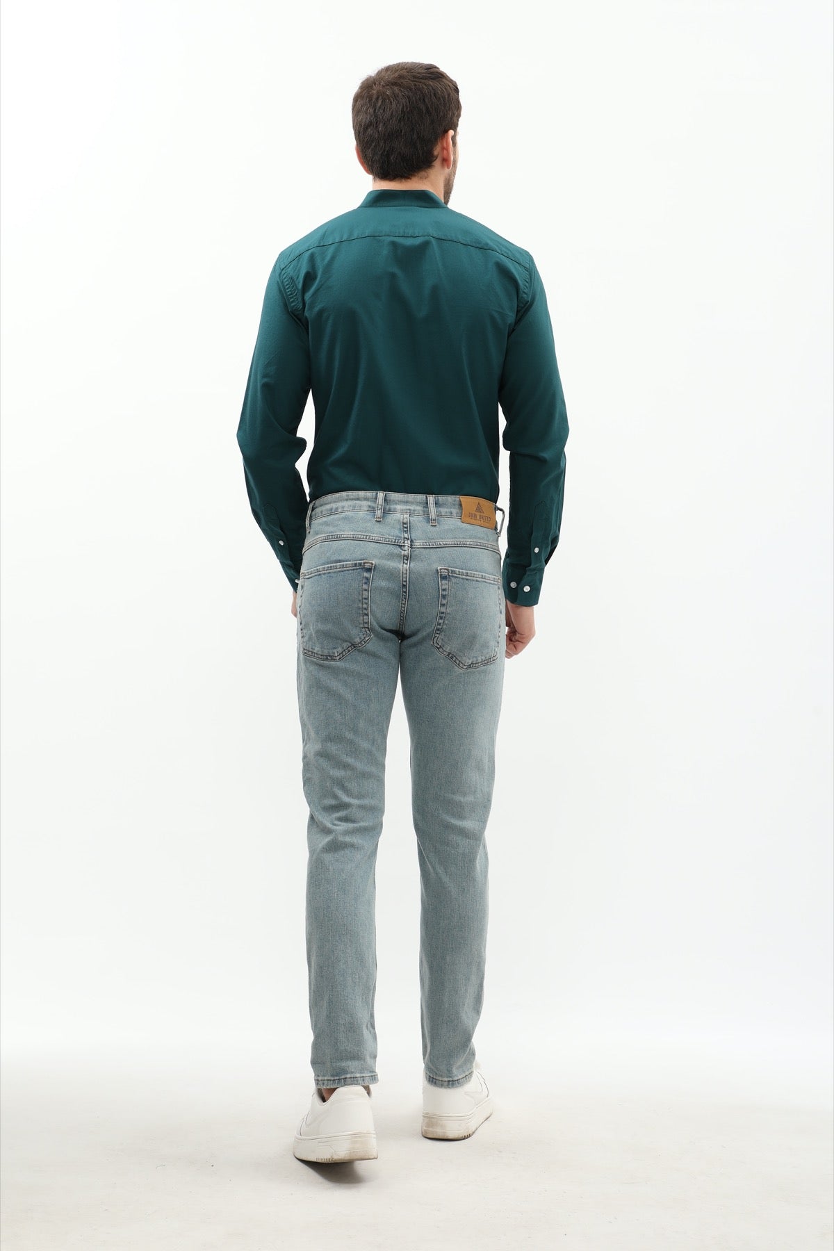 جينز Slim Fit من DNM UNITED - لون أزرق فاتح باهت