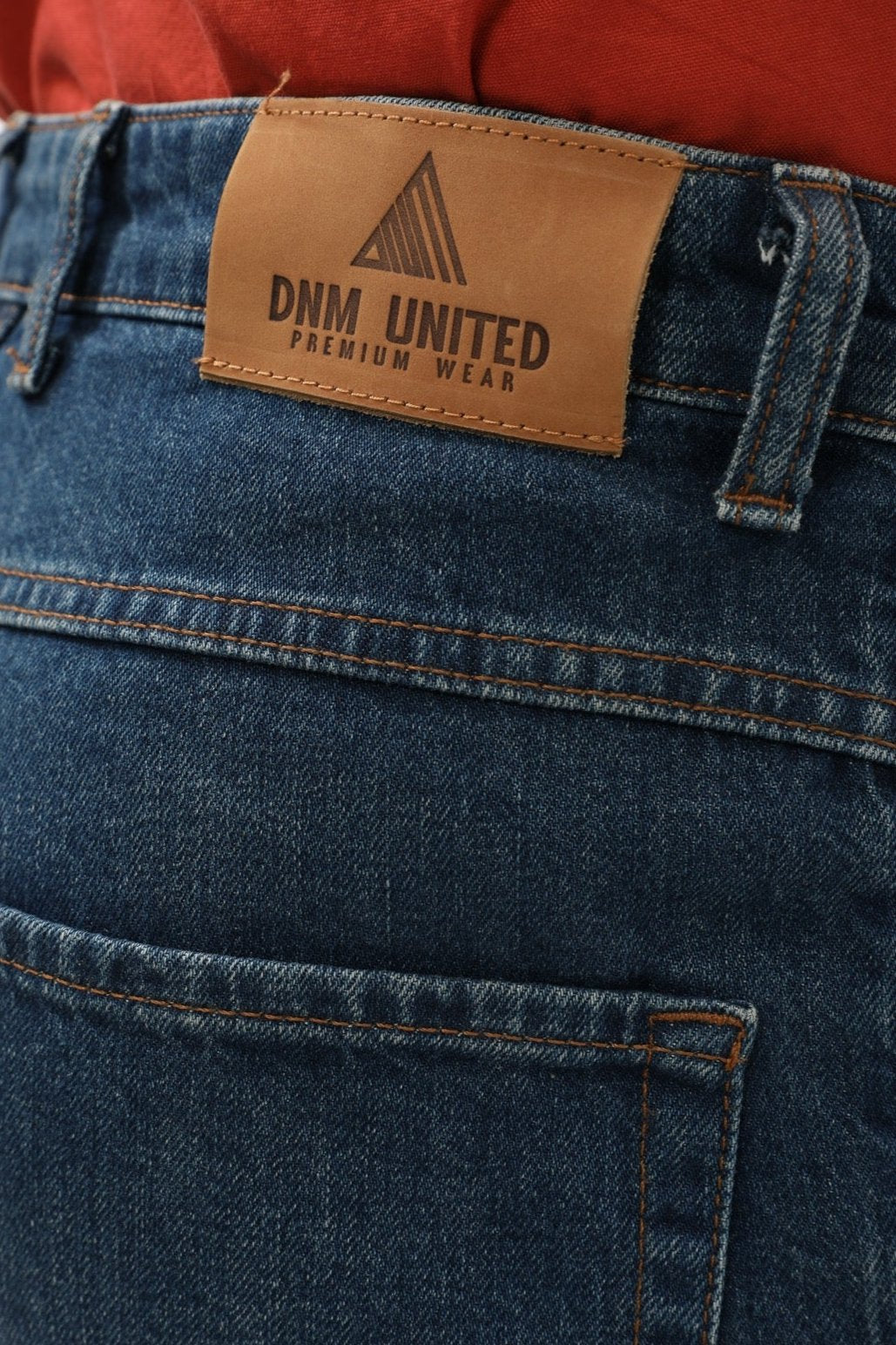 جينز Slim Fit من DNM UNITED - لون أزرق غامق باهت