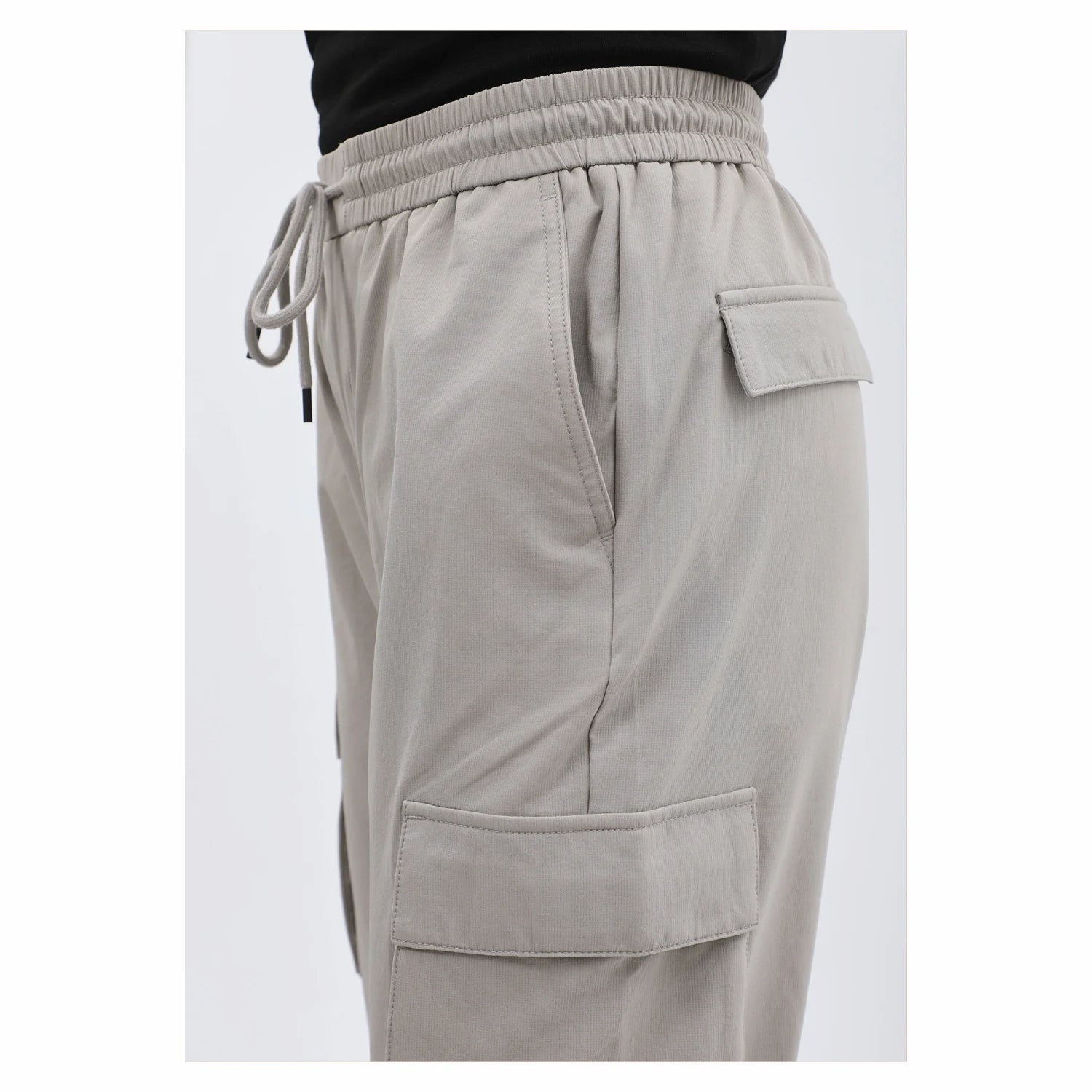 Beige men's cargo pants with side pockets and drawstring waistband – BagyBagy Saudi men's fashion.