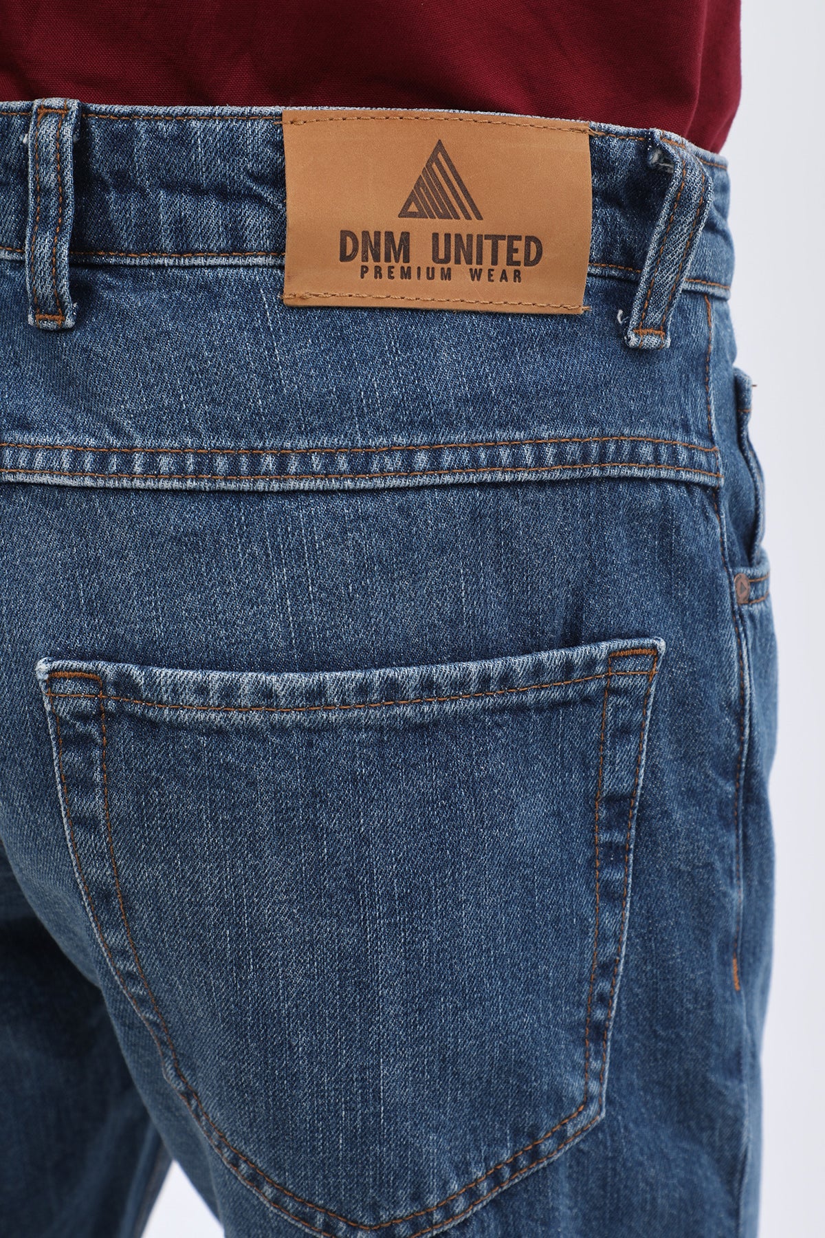 جينز Slim Fit من DNM UNITED - لون أزرق كلاسيكي